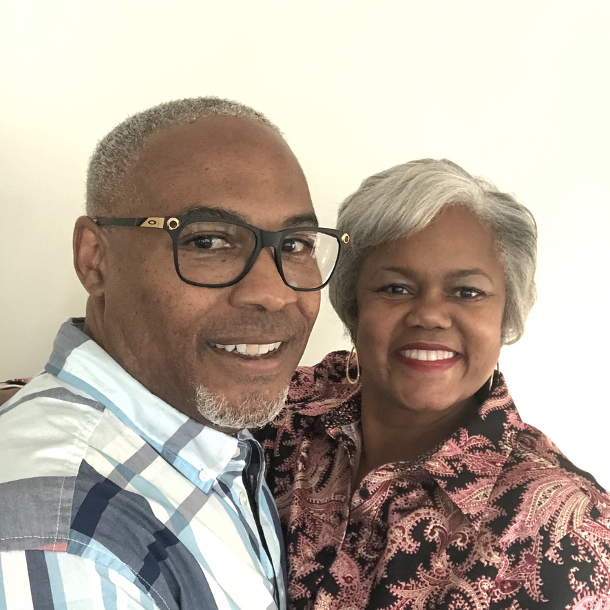 A man and woman smiling for the camera.